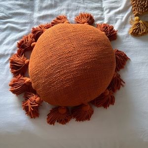 Rust orange circle throw pillow from Urban Outfitters